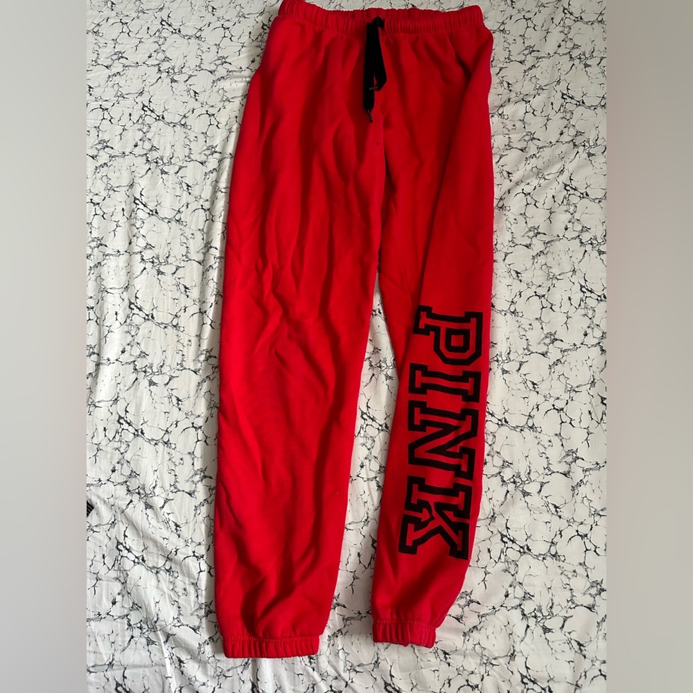 Red pink VS jogger pants. Has small 3 black marks. In good condition